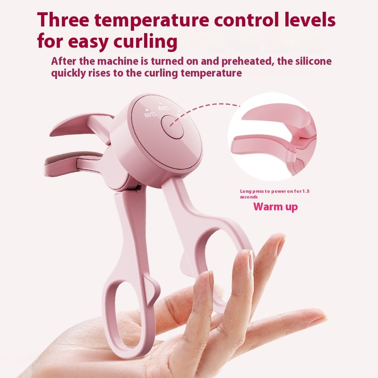 a hand holding a pink tool