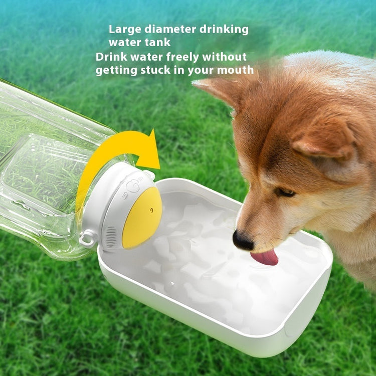 a dog drinking water from a plastic bottle