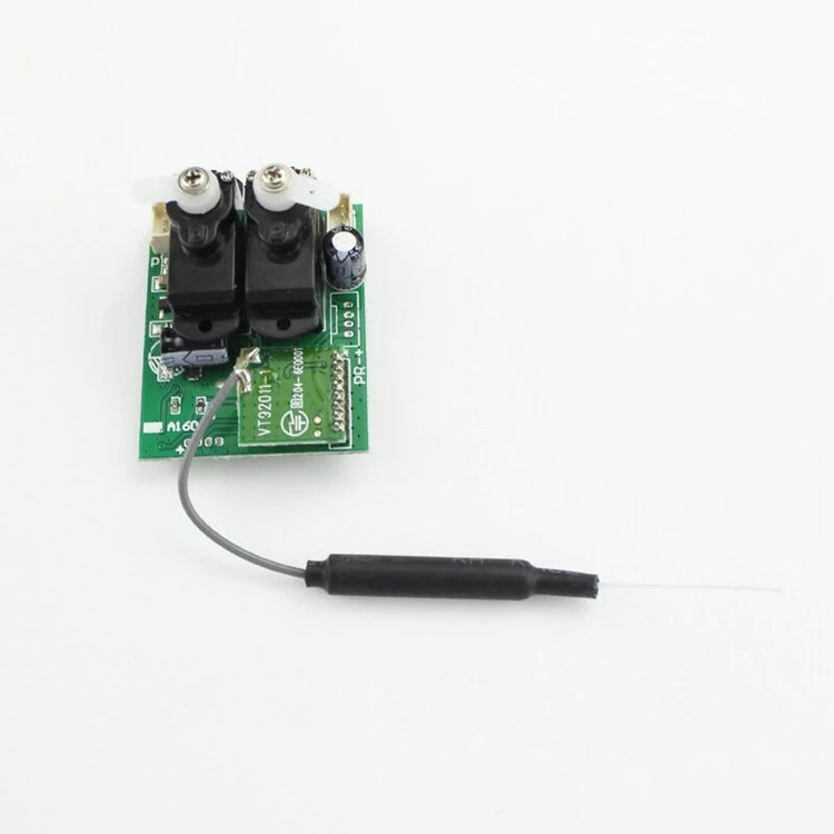 a small green circuit board with black wires