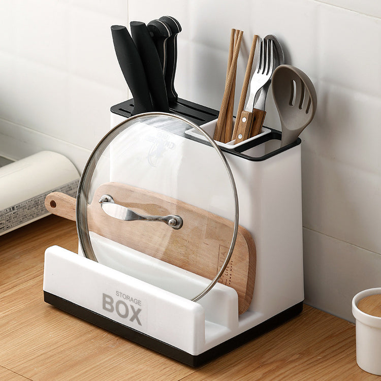 a white and black container with utensils in it
