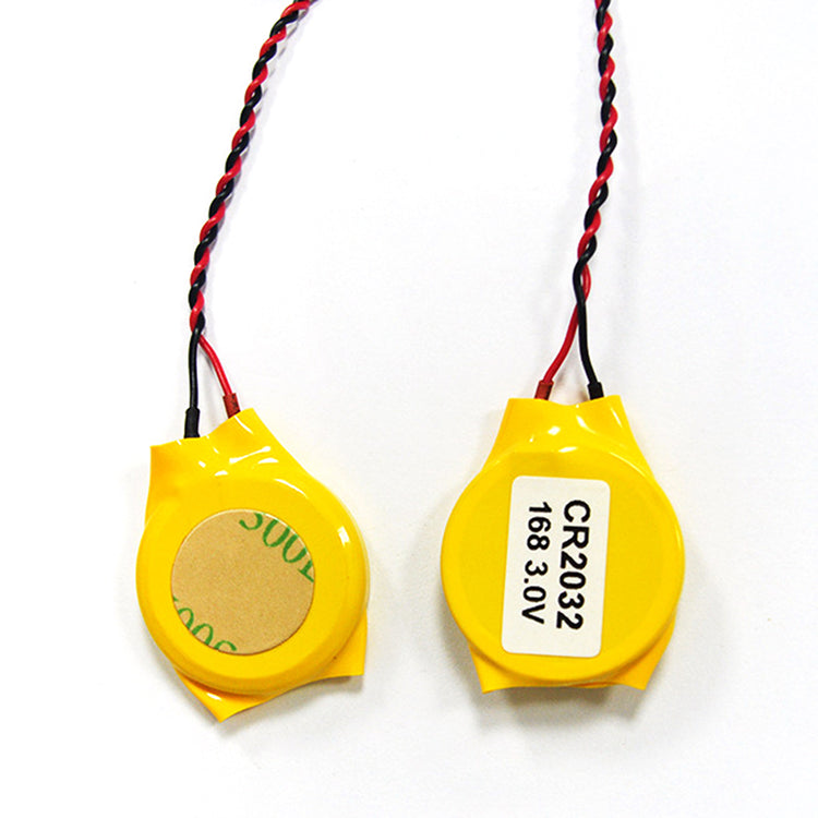 a pair of yellow batteries with wires