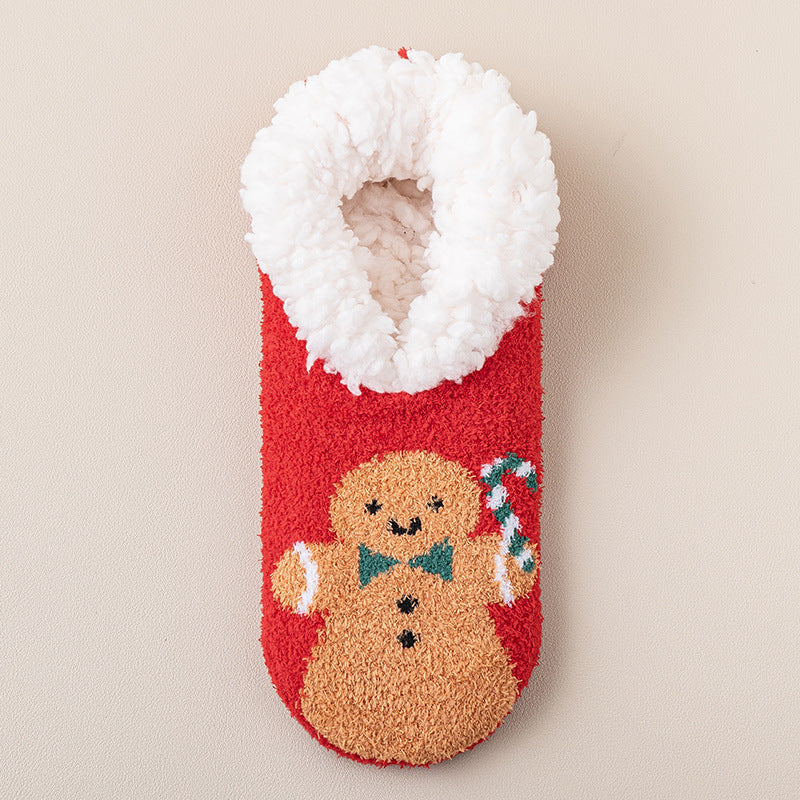a red and white fuzzy sock with a gingerbread man and candy cane
