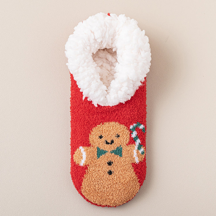a red and white fuzzy sock with a gingerbread man and candy cane