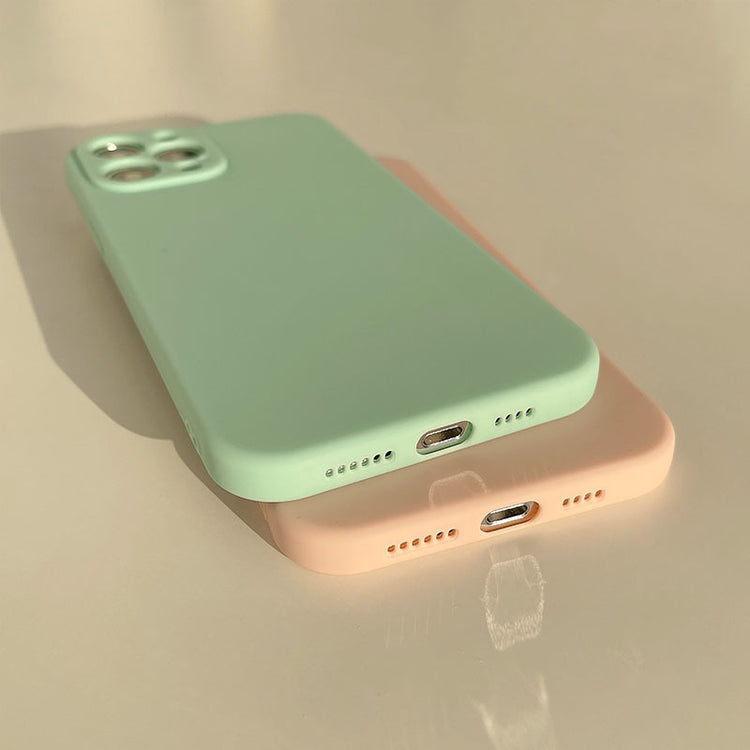 a two cell phones on a table