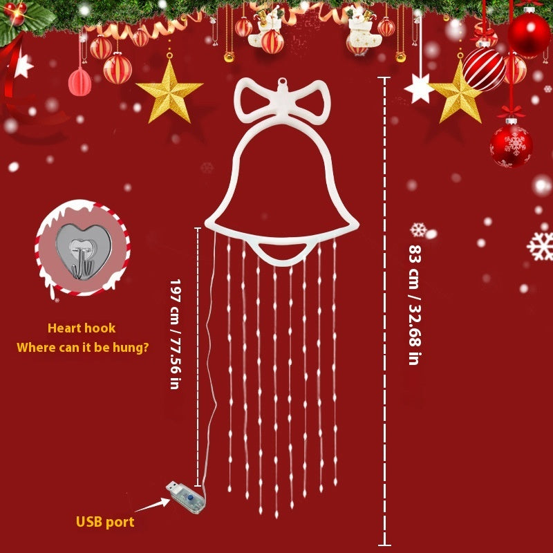 a bell with a string of lights and ornaments