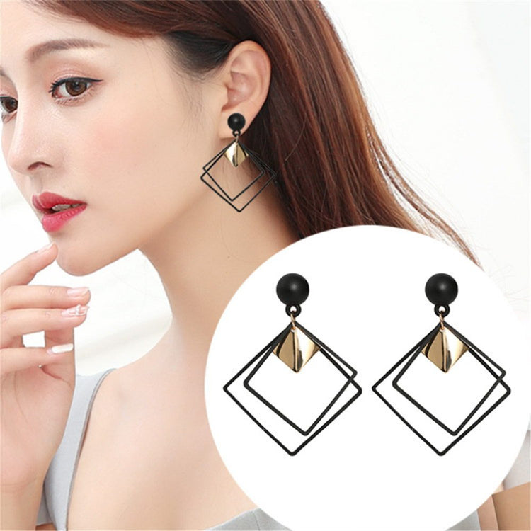 a woman wearing earrings and a picture of her face