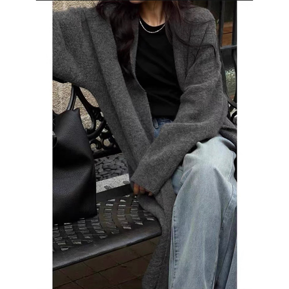 a woman sitting on a bench