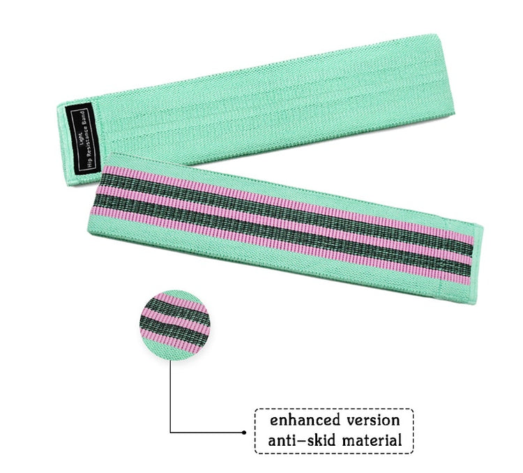 a green and pink wrist bands