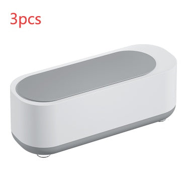 a white rectangular object with a grey lid