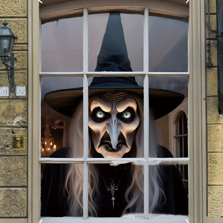 a person in a garment looking out a window