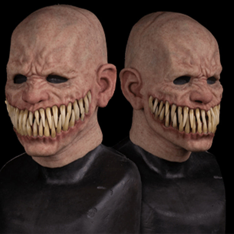 two people wearing masks with teeth