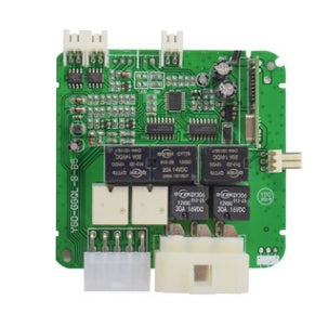 a green circuit board with many small black and white components
