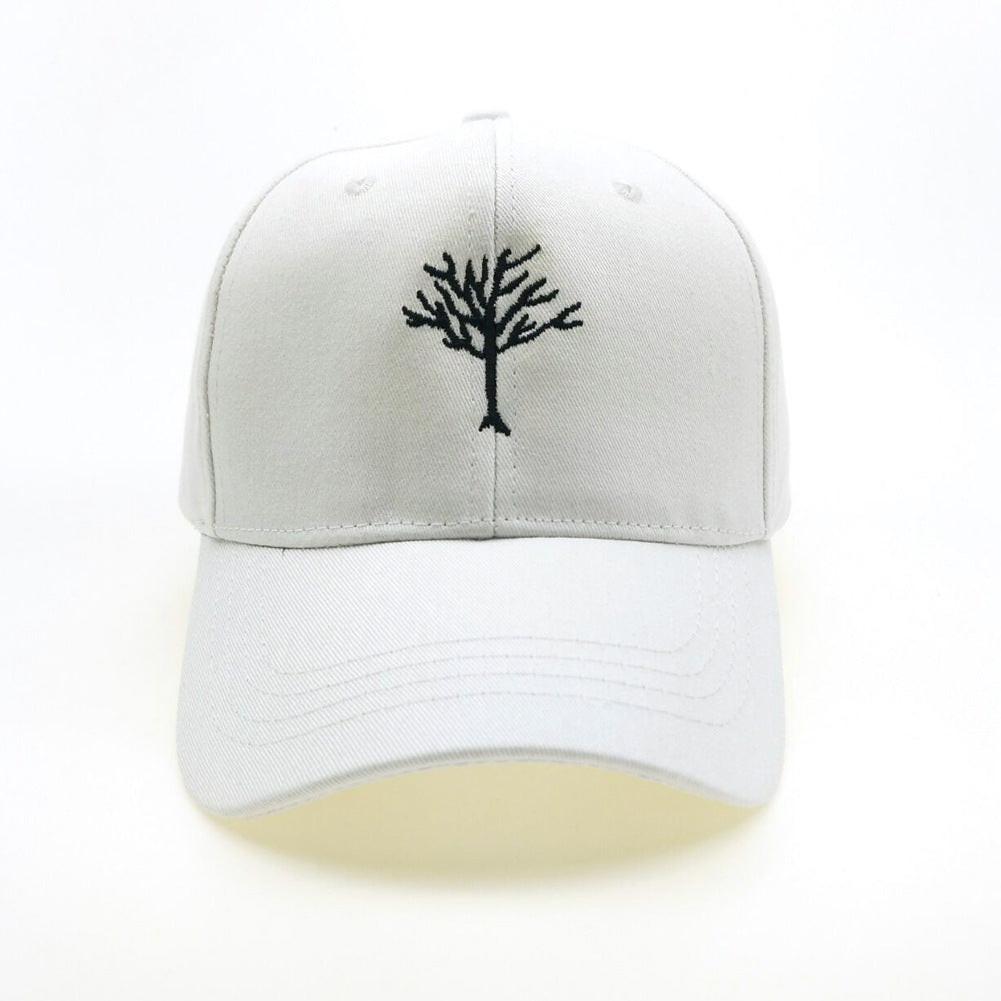 a white hat with a tree on it