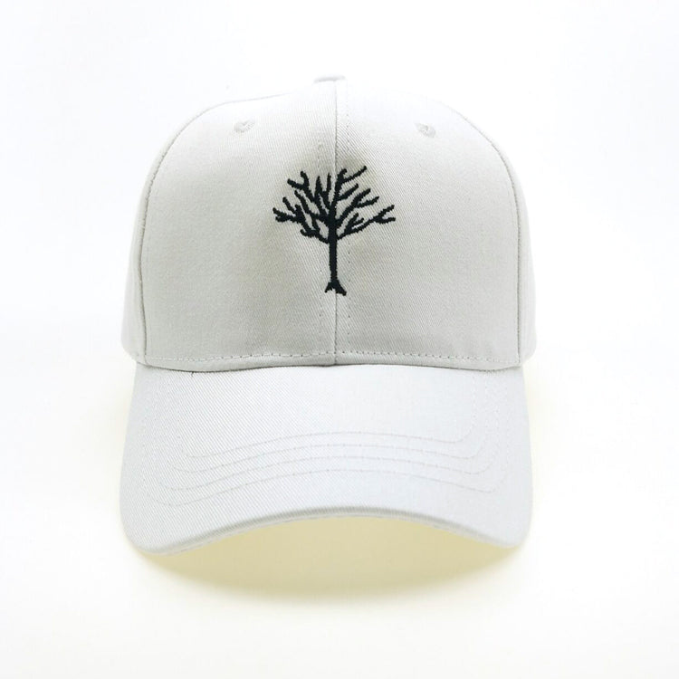 a white hat with a tree on it