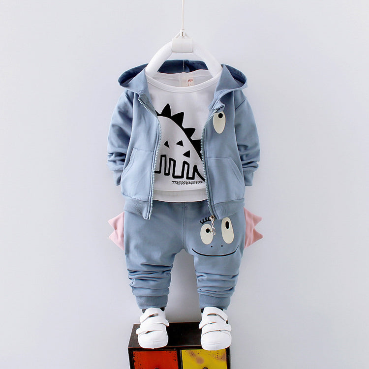a blue jacket and pants on a white wall