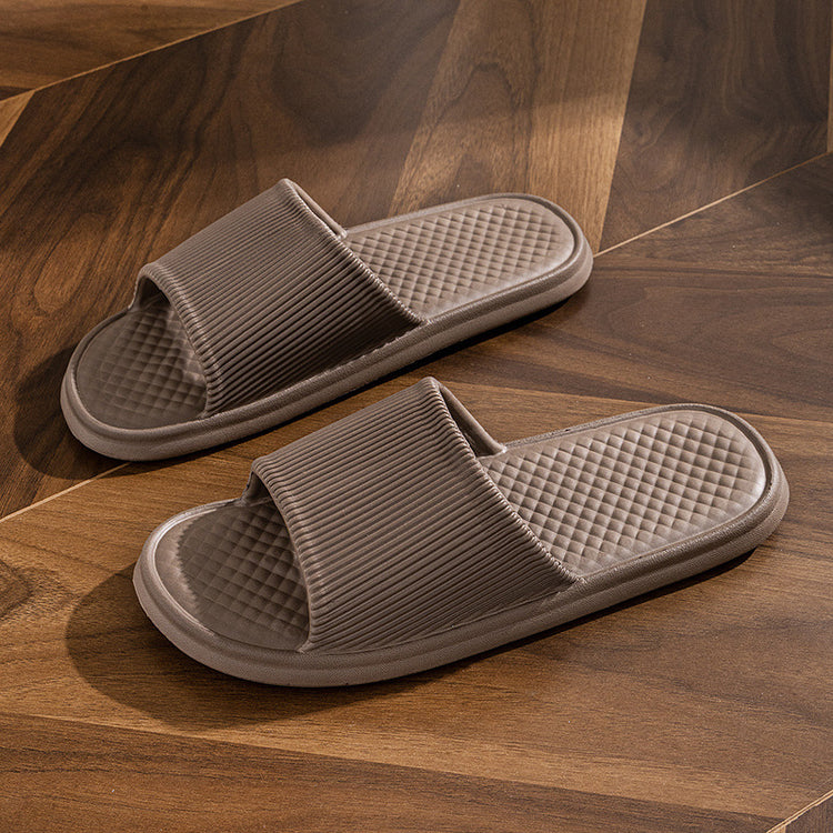 a pair of slippers on a wooden surface