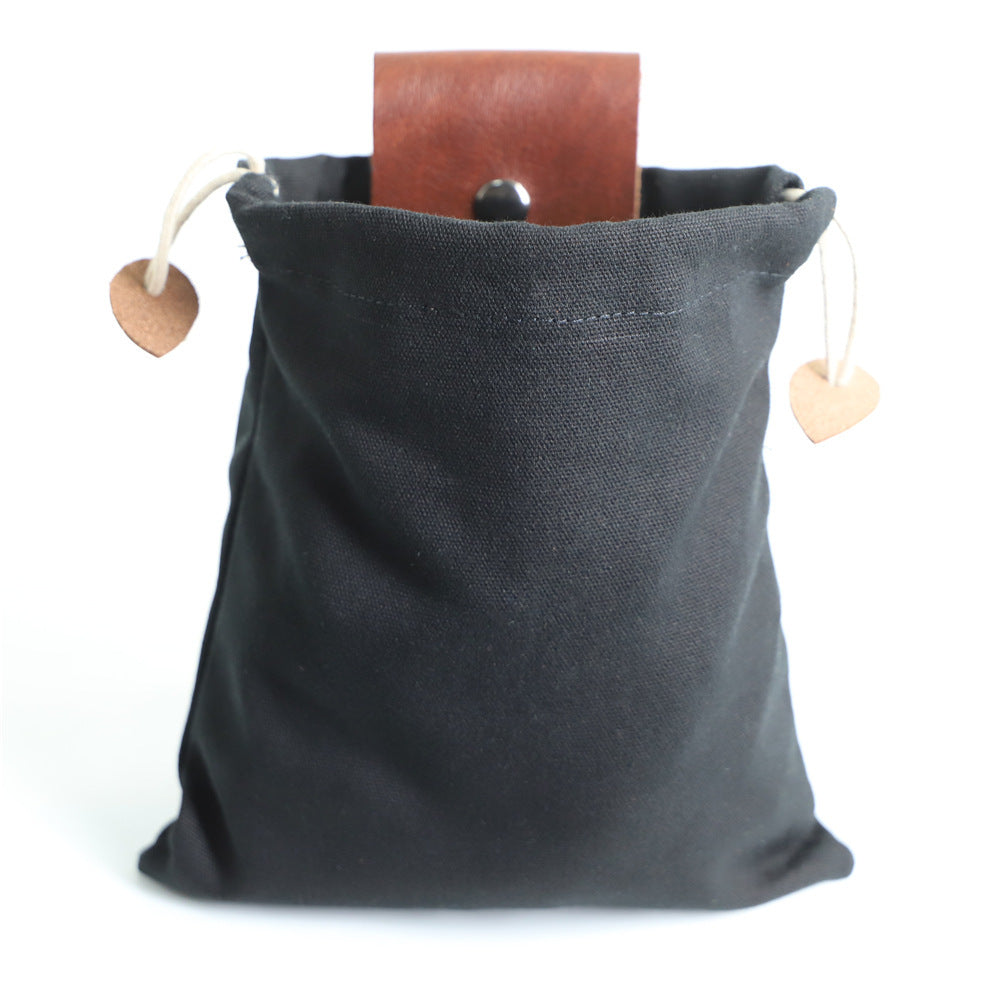 a black bag with a brown leather belt inside