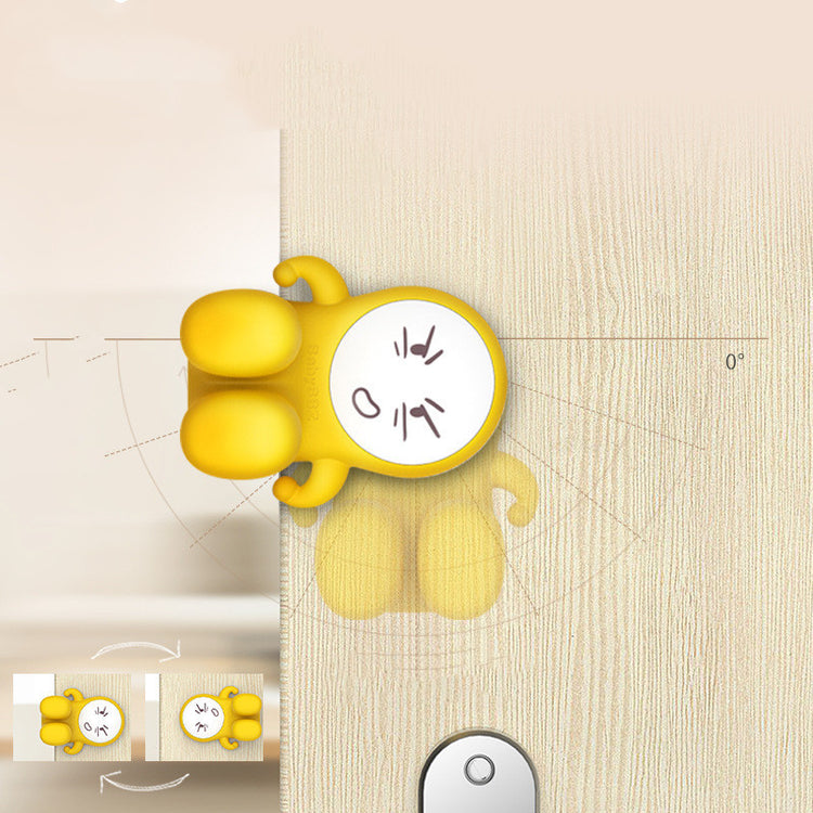 a yellow cartoon character on a wooden surface