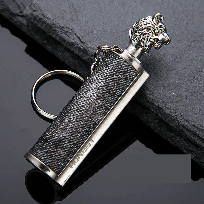a key chain with a lion head on it