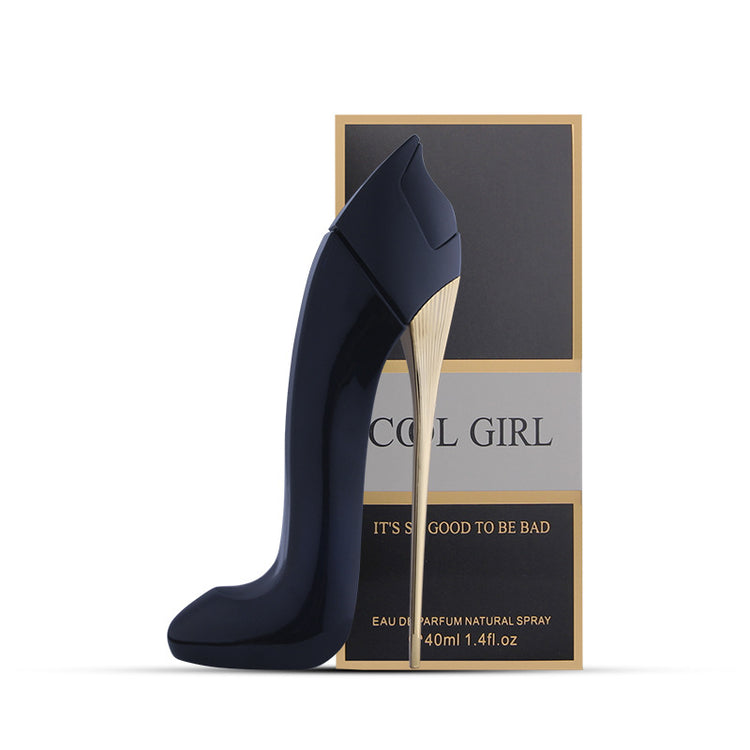 a bottle of perfume next to a box