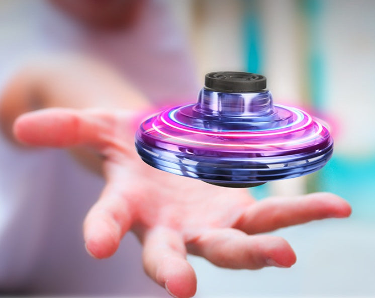 a hand with a spinning top