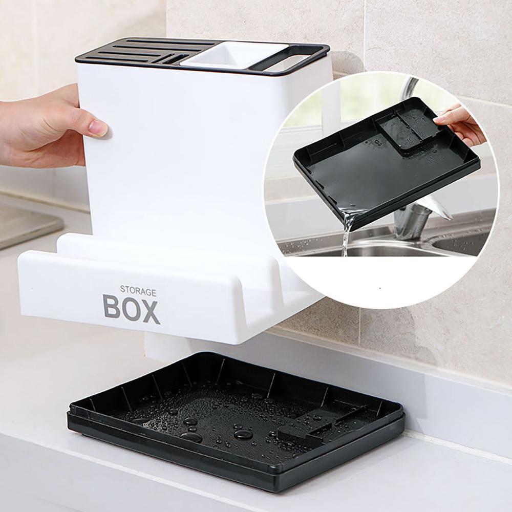 a hand holding a tray with water