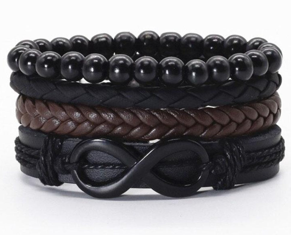 a stack of black and brown leather bracelets