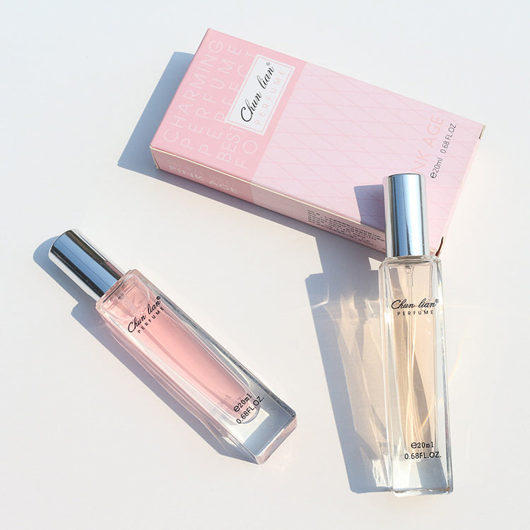 a bottle of perfume next to a box
