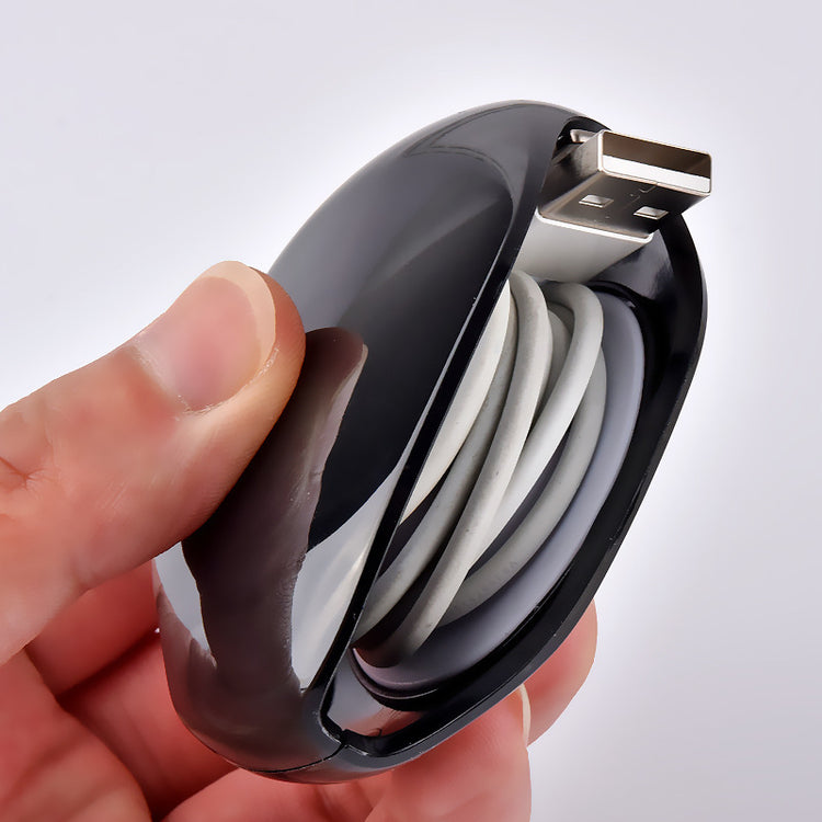 a hand holding a usb cable