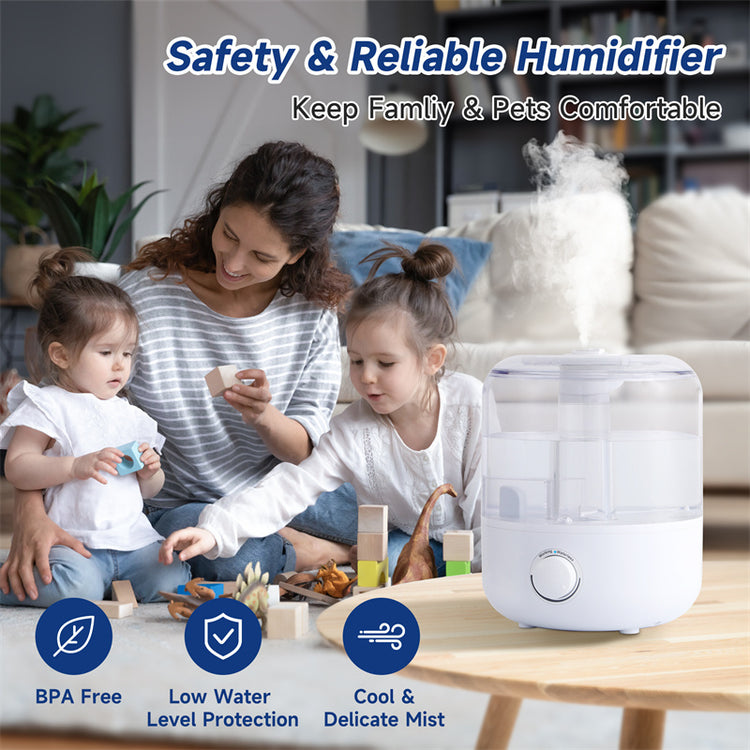 a woman and two children sitting on the floor with a humidifier