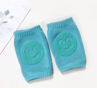 a pair of blue socks with smiley faces on them