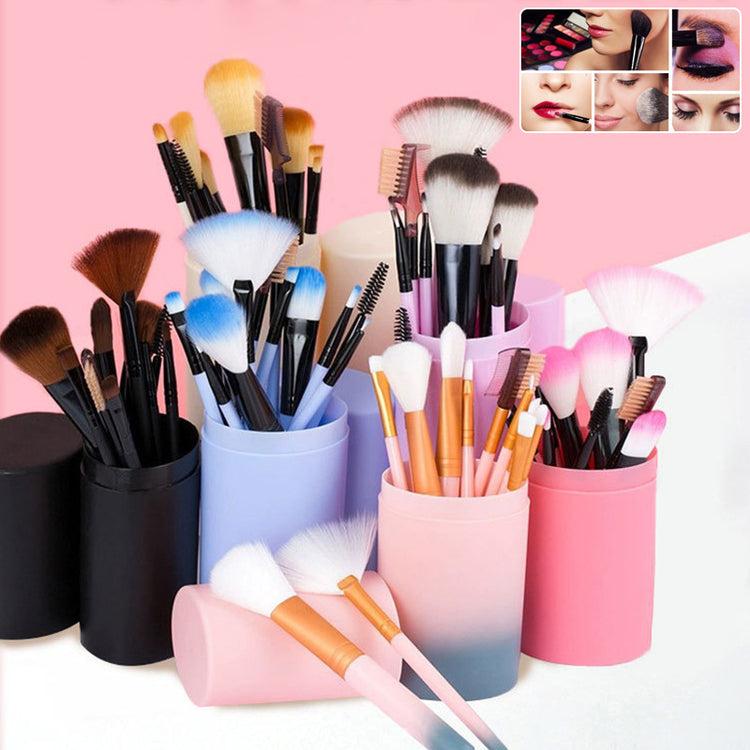 a group of makeup brushes in containers