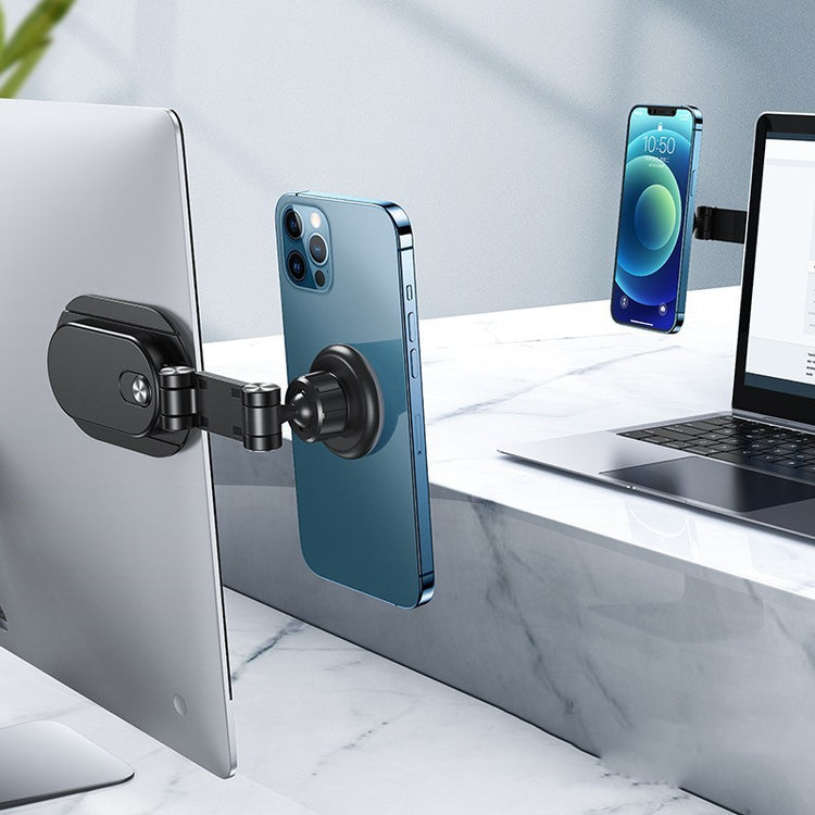 a laptop and cell phone attached to a couple of screens