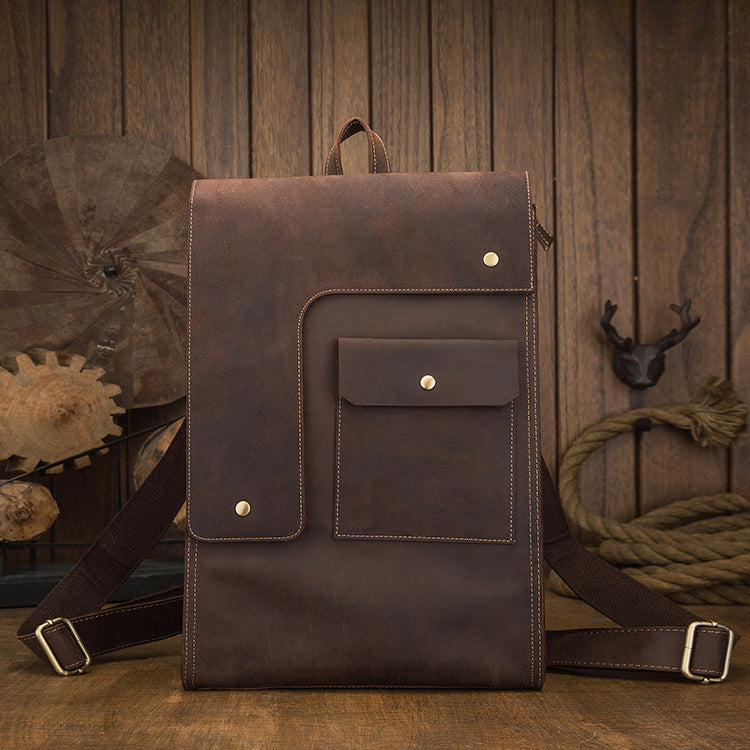 a brown backpack on a wood surface