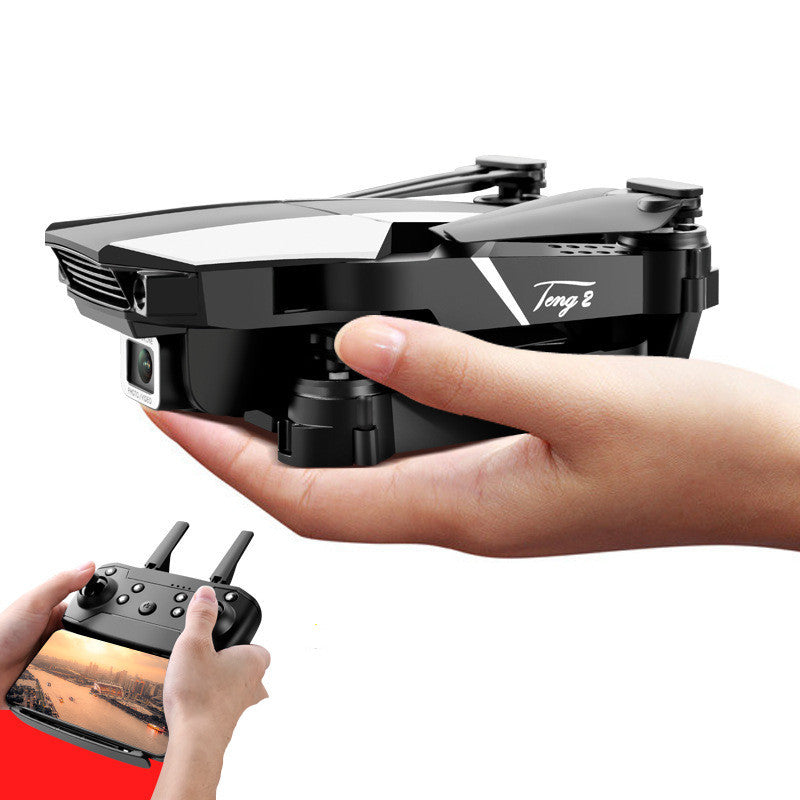 a hand holding a drone