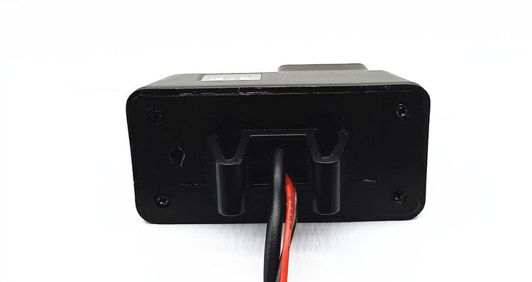 a black box with red and black wires