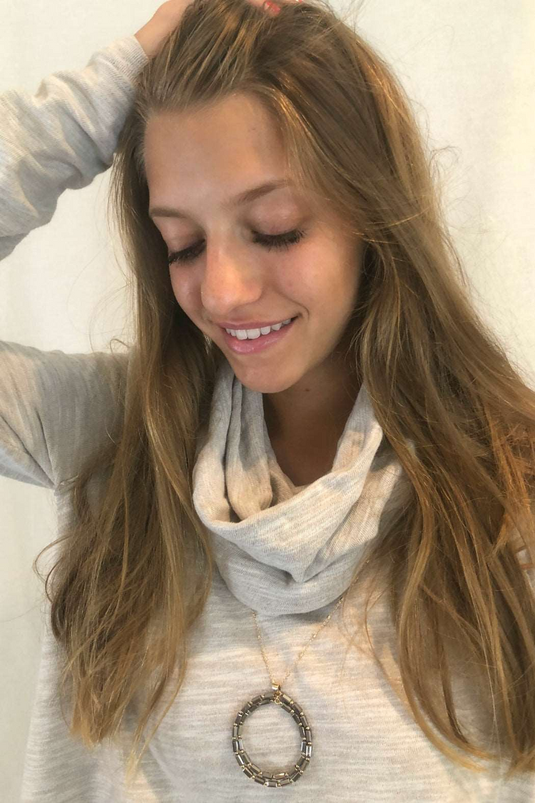 a woman with long hair and a scarf