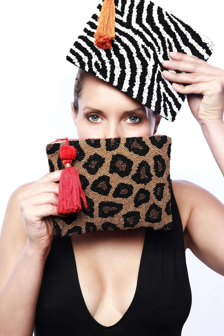 a woman holding a purse and a bag