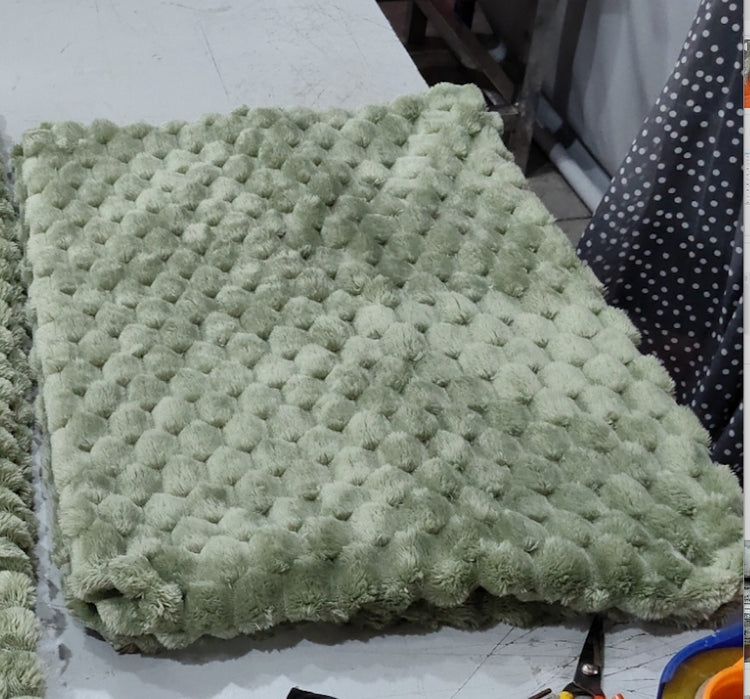 a green blanket on a table