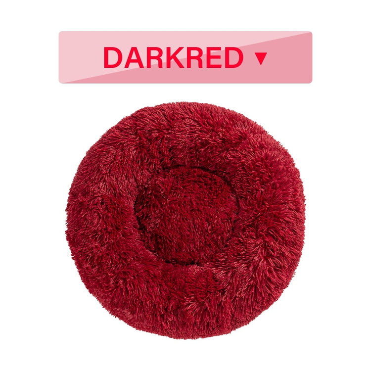 a red fluffy pillow with a red circle