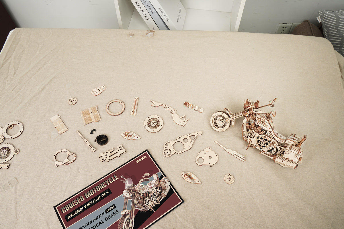 a wooden motorcycle model on a table