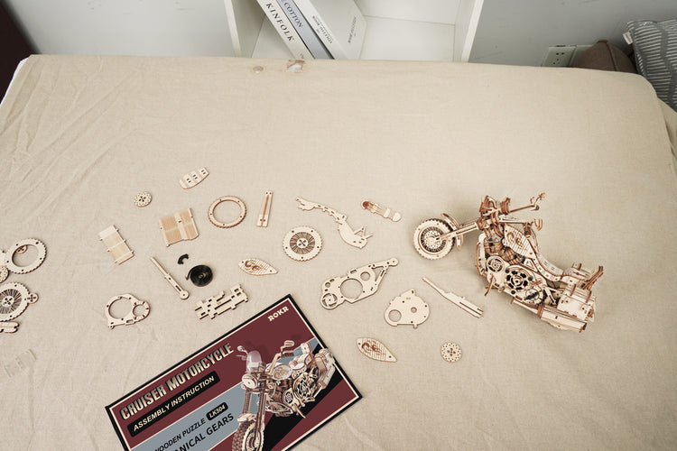 a wooden motorcycle model on a table