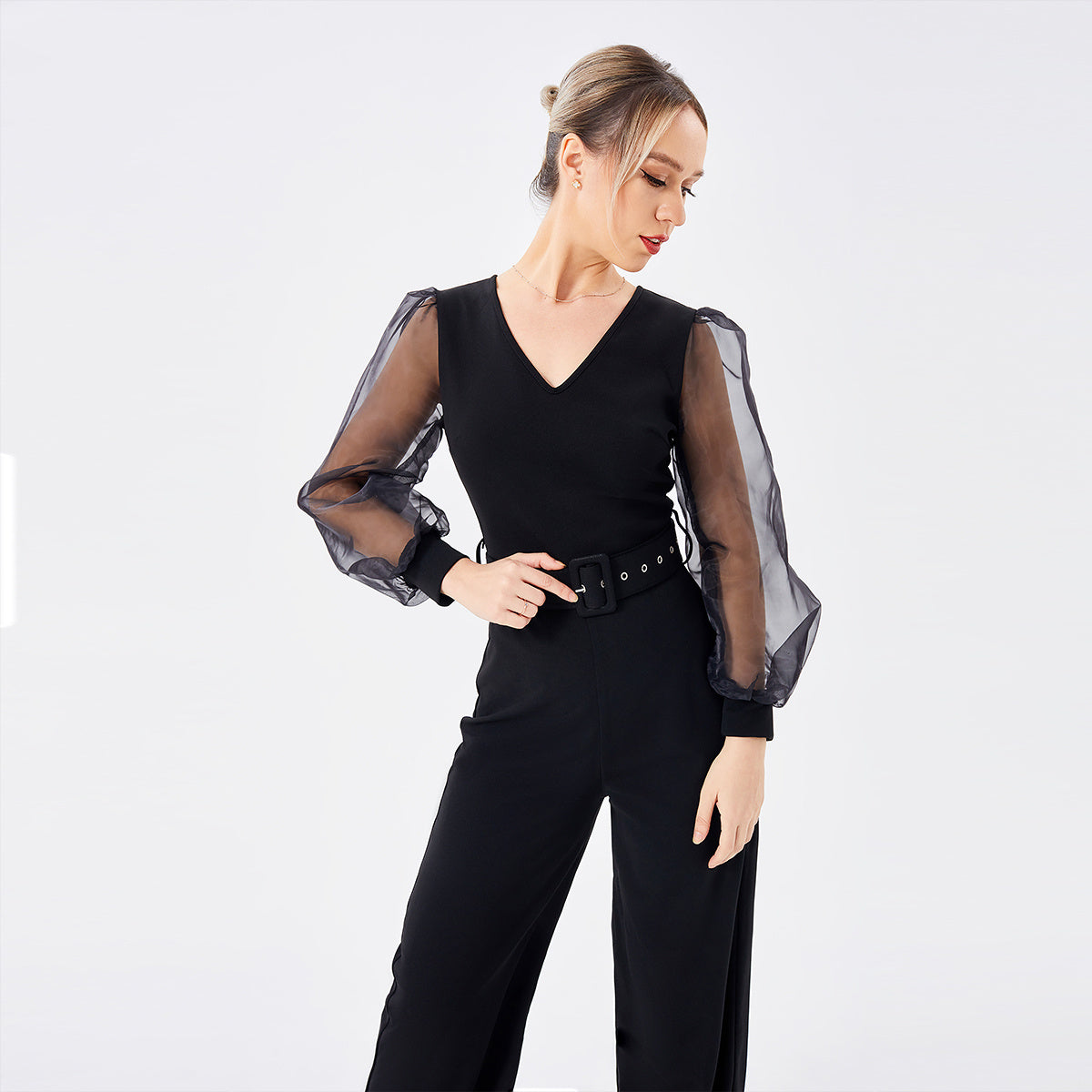 a woman in a black jumpsuit