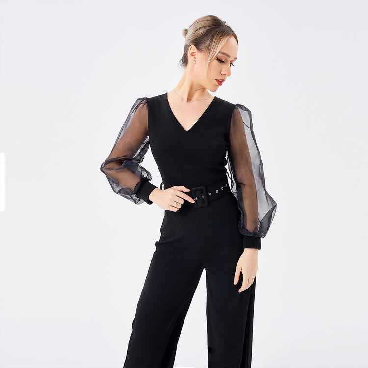 a woman in a black jumpsuit