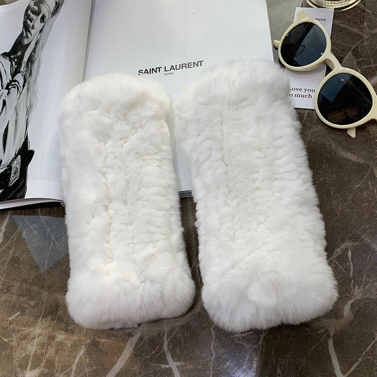 a pair of fur slippers on a table