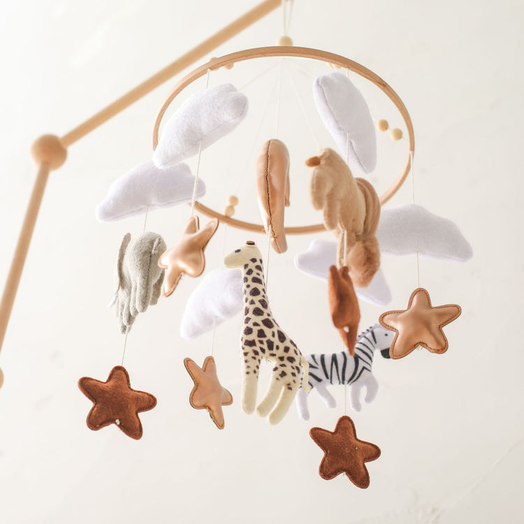 a mobile with different animals and stars