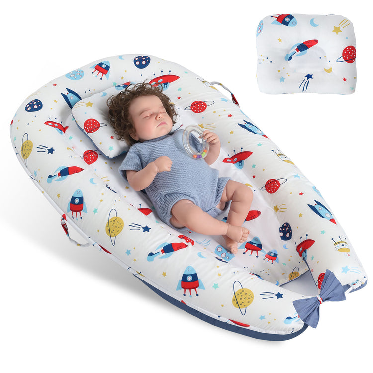 a baby sleeping in a baby bed