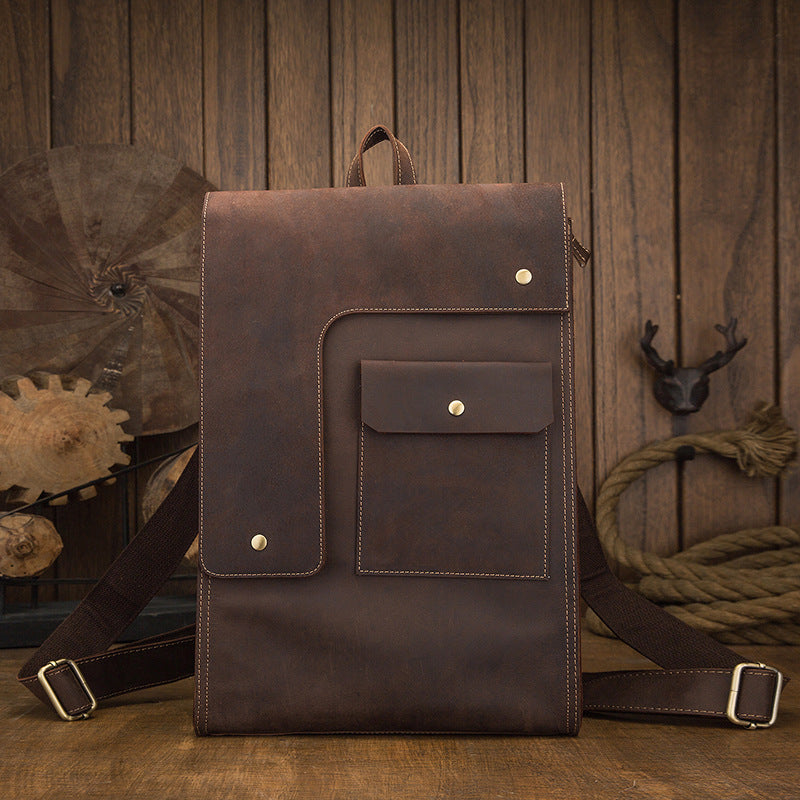 a brown backpack on a wood surface