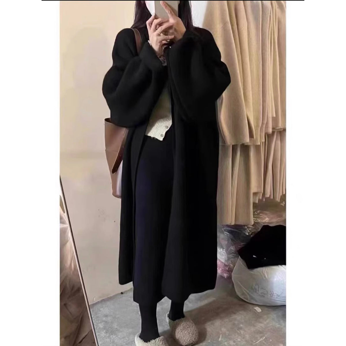a woman in a black coat
