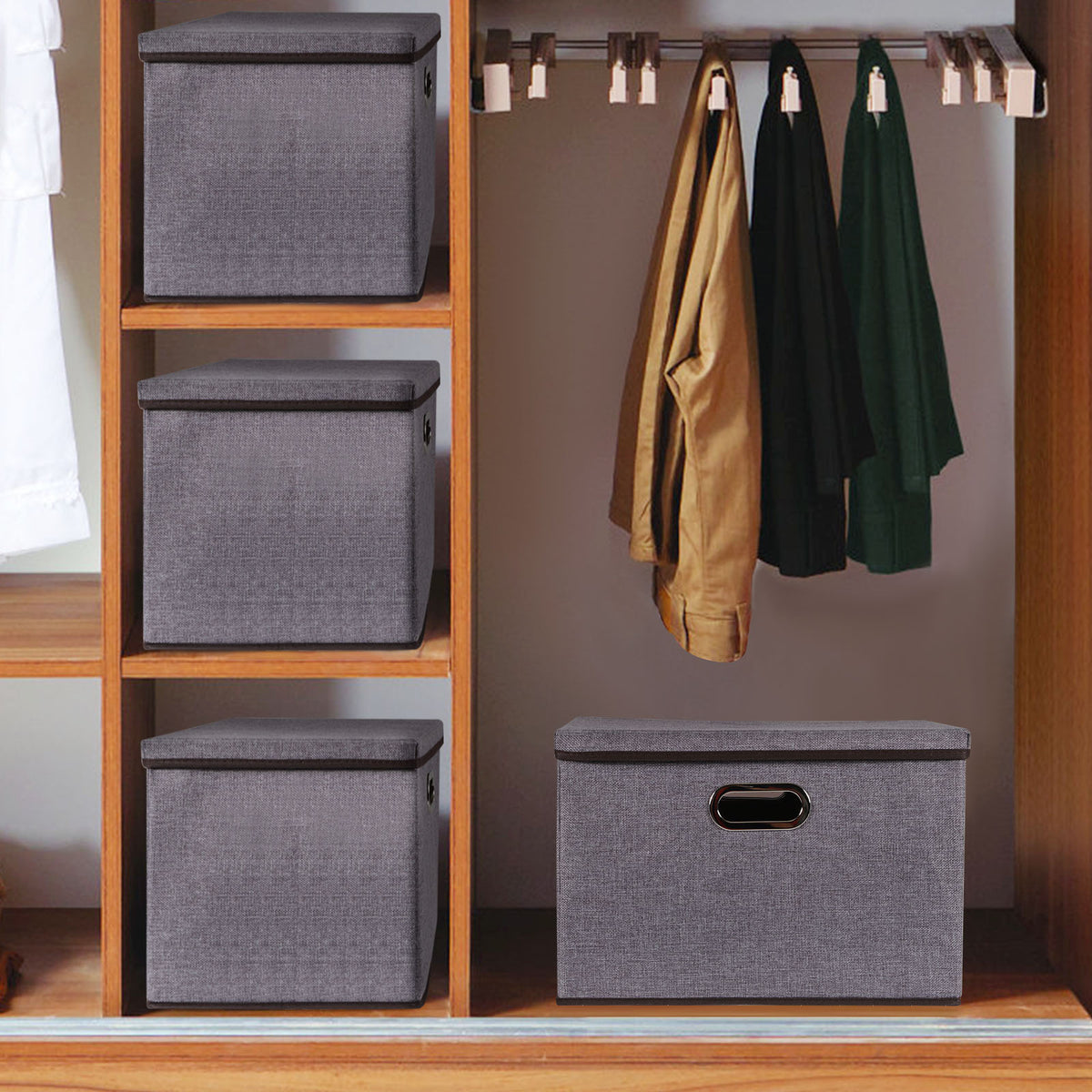 a closet with grey boxes and clothes on a swinger